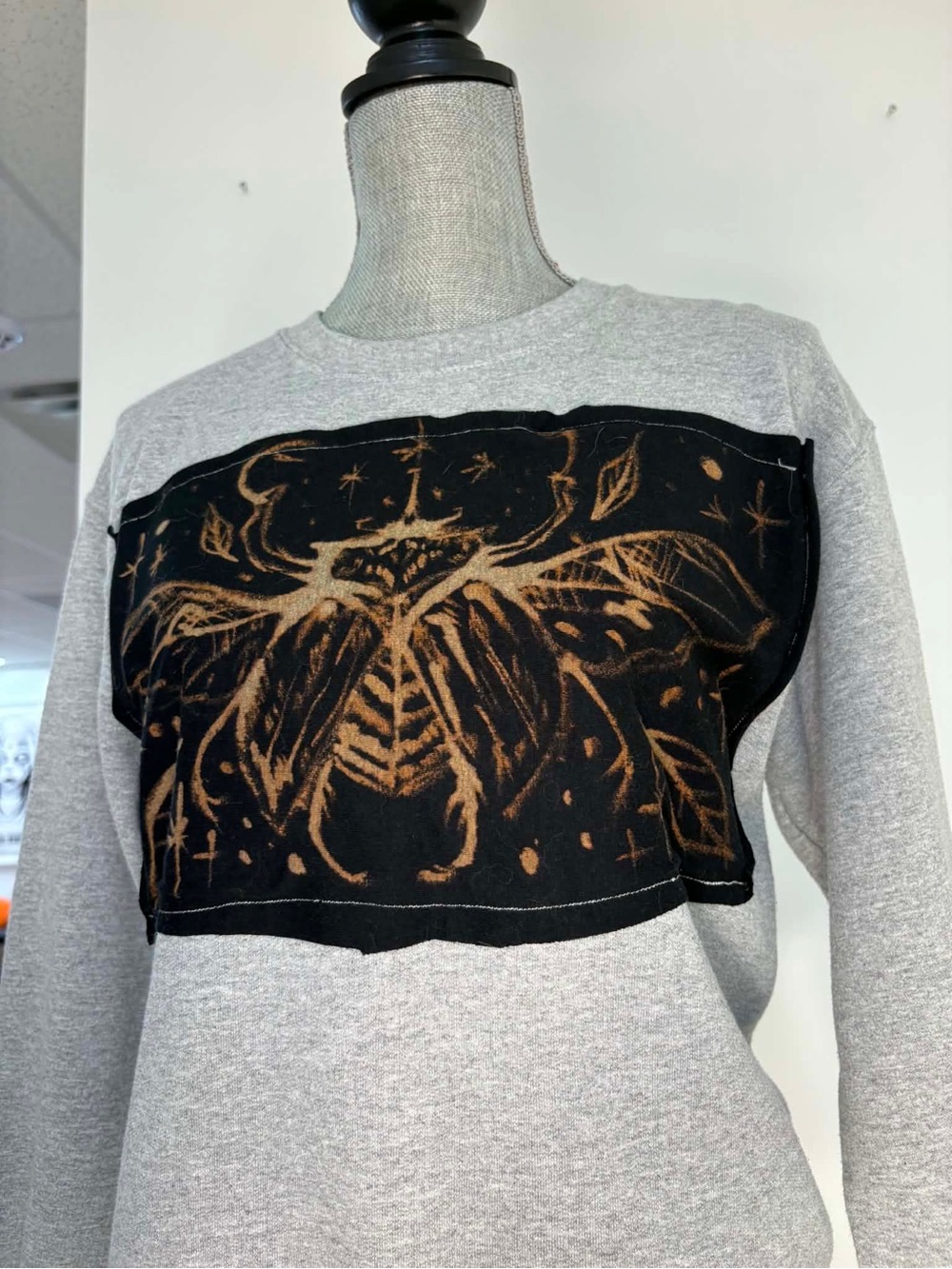 Grey Sweatshirt with Black & Rust bleach beetle design